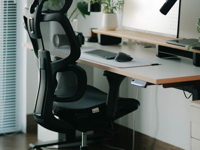 Ergonomic office setup with soft lighting and plants